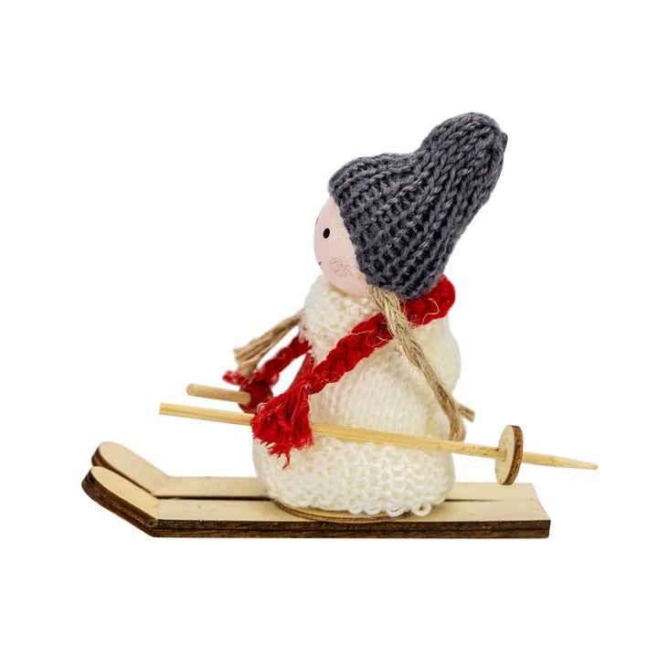 Christmas ornament of a girl skiing with poles